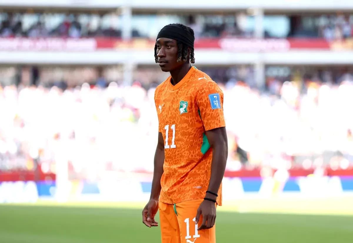 Player wearing orange jersey on the field