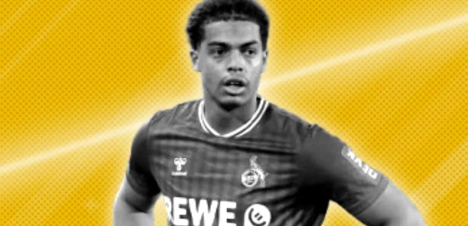 Player in football kit with team logo