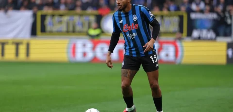 Player in Atalanta kit preparing to play ball