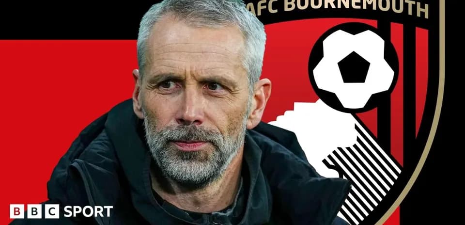 AFC Bournemouth manager with club logo background