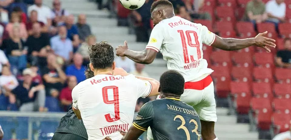 Players contesting for the ball during match