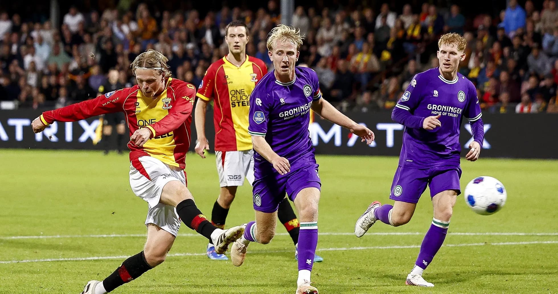 Player kicking the ball during a football match