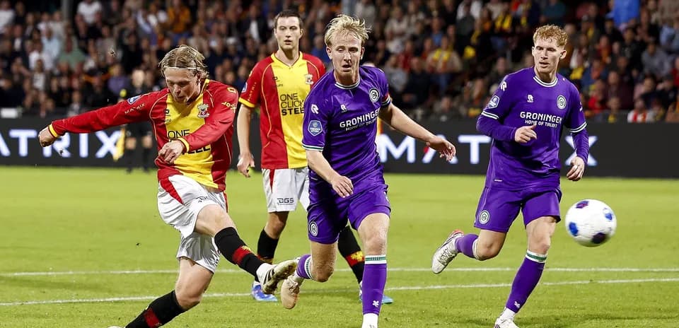 Player kicking the ball during a football match