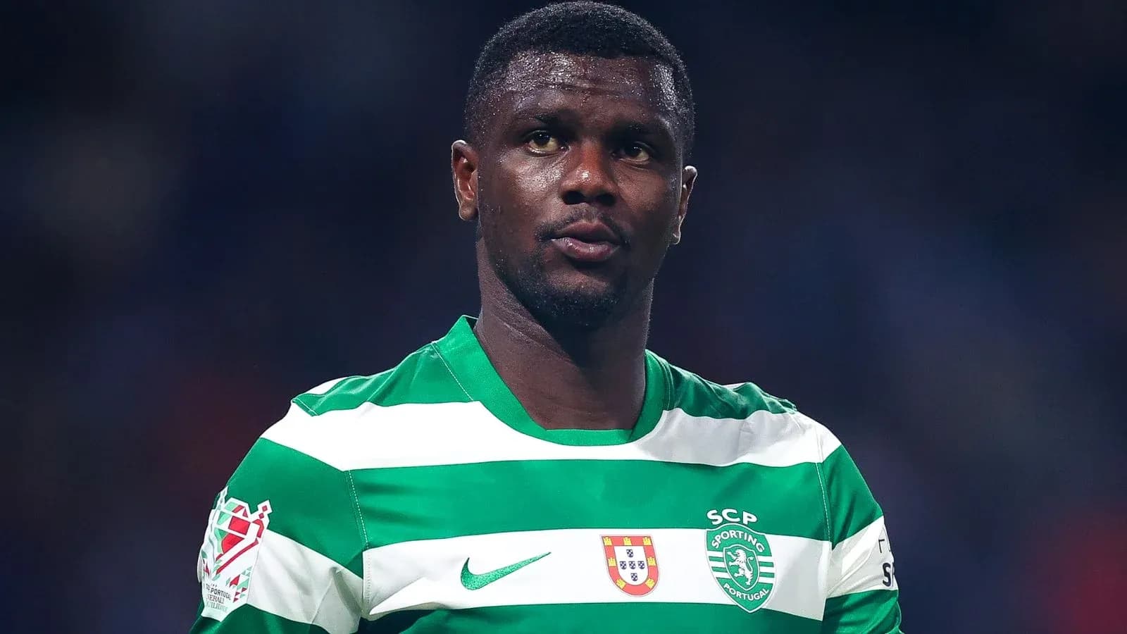Player in green and white striped jersey during match
