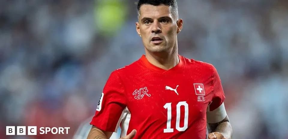 Player wearing red jersey during match action