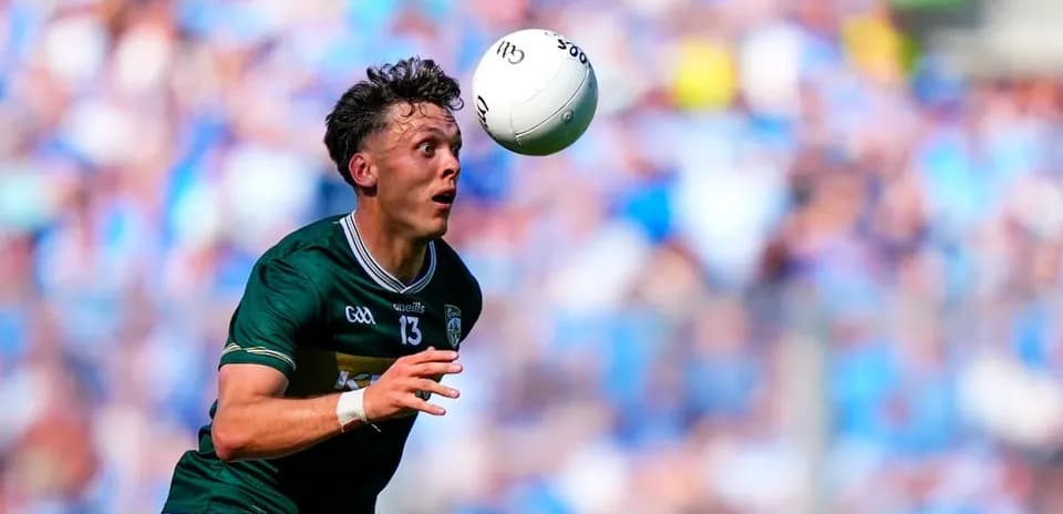 Player catching a ball during a football match