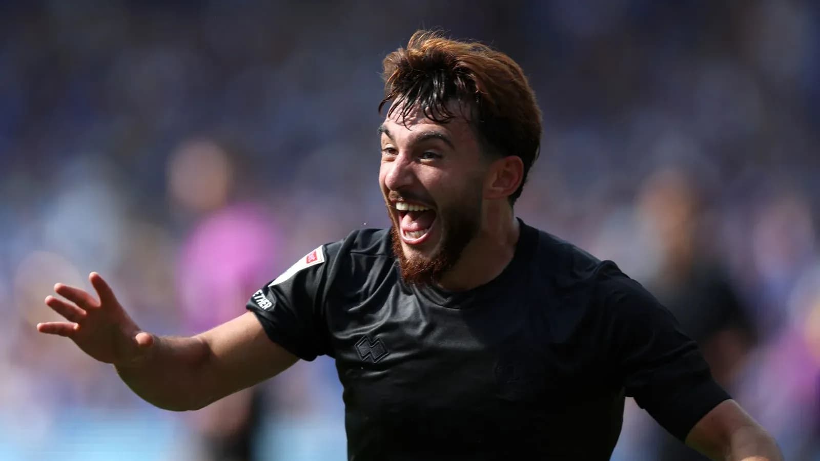 Player celebrating a goal with outstretched hand