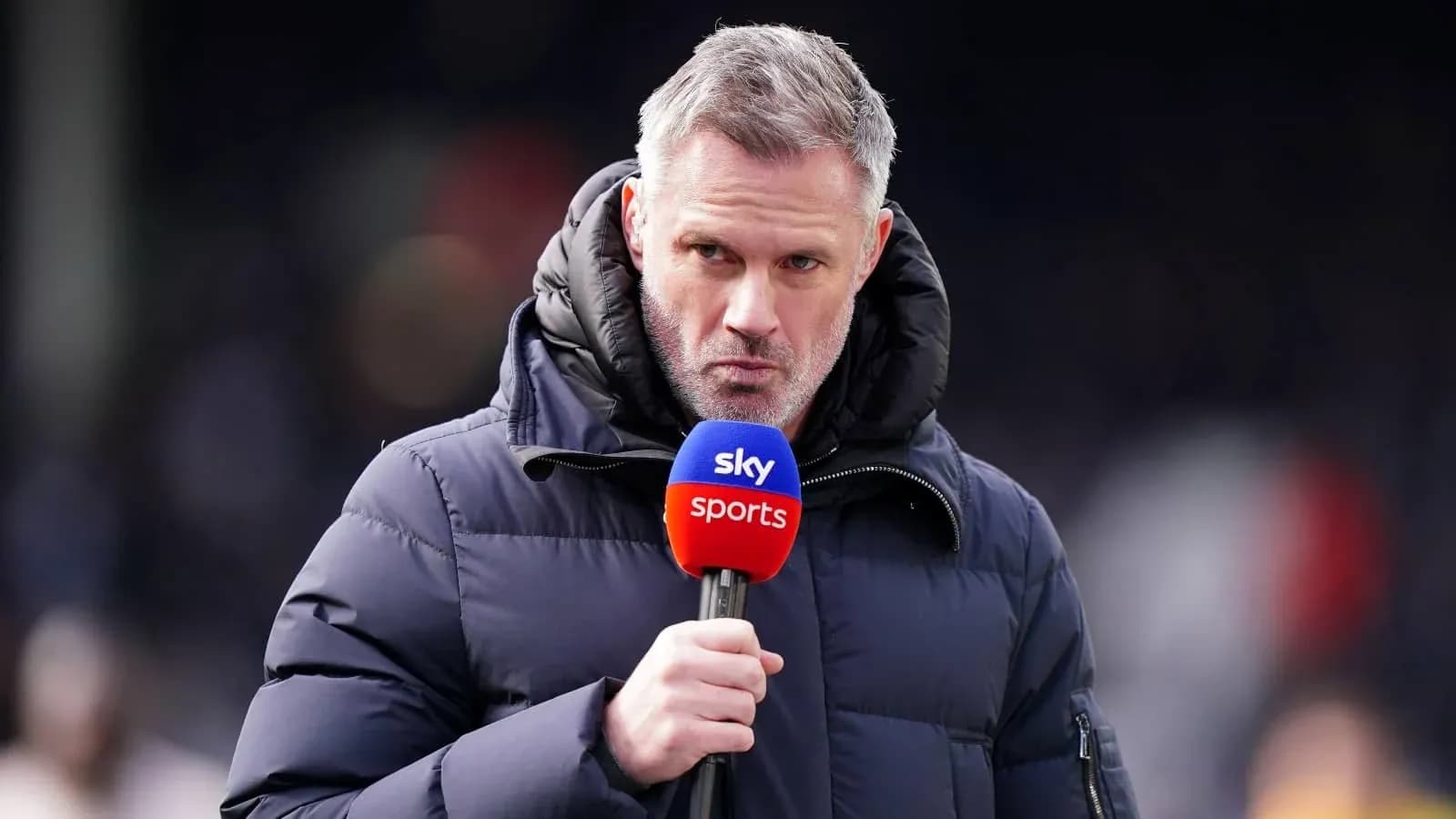 Presenter speaking into microphone during broadcast