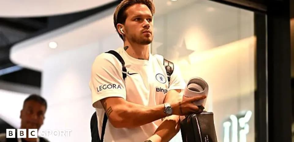 Player arriving at venue carrying equipment and headphones