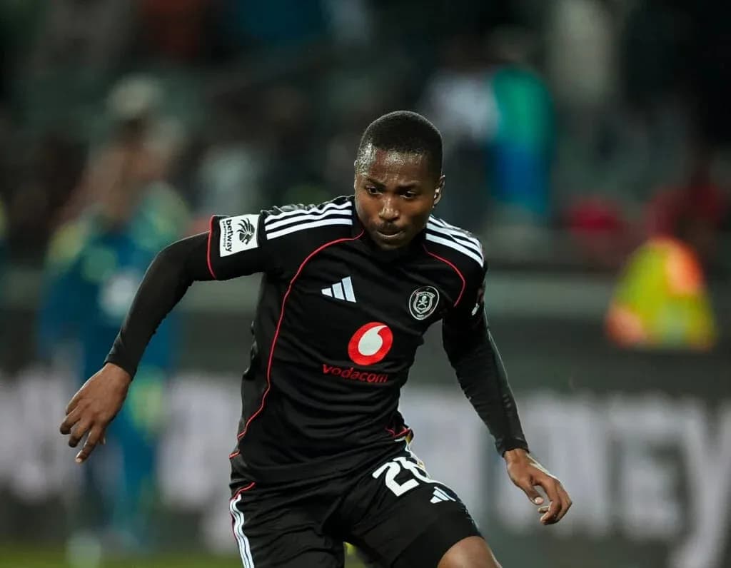 Player running during a match in black kit