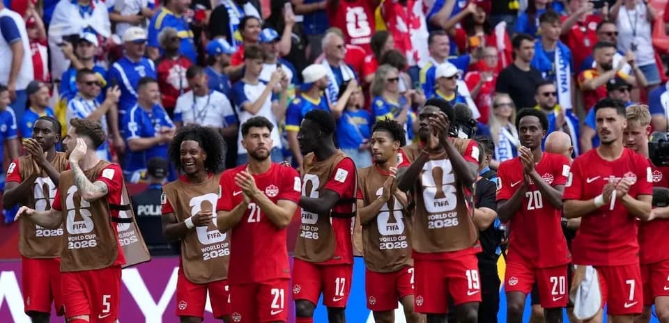 Canadian soccer team applauding fans after match