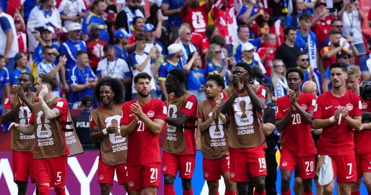 Canadian soccer team applauding fans after match
