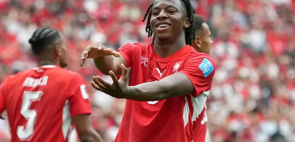 Swiss player celebrating with teammates during match