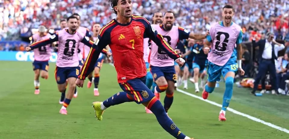 Player celebrating with teammates after scoring goal