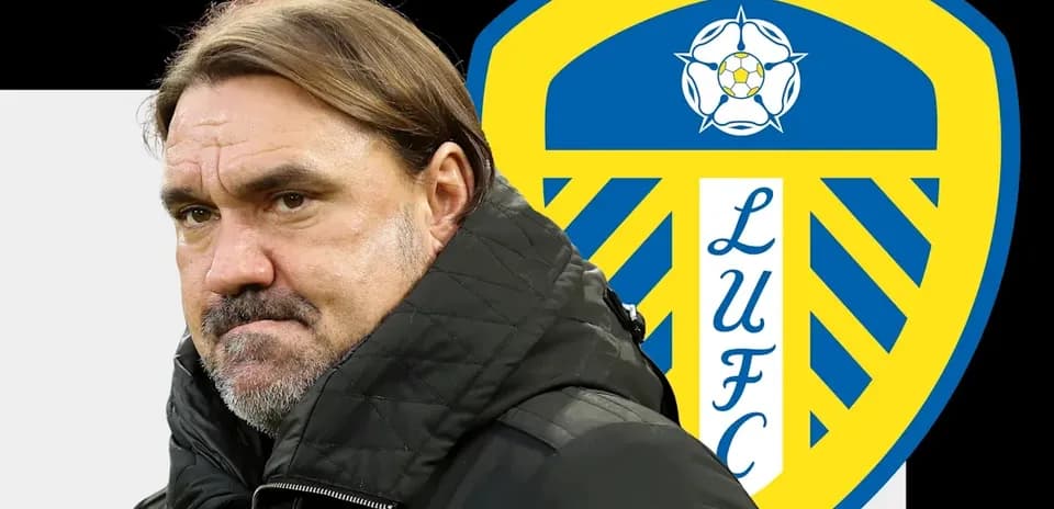 Coach in front of Leeds United club logo