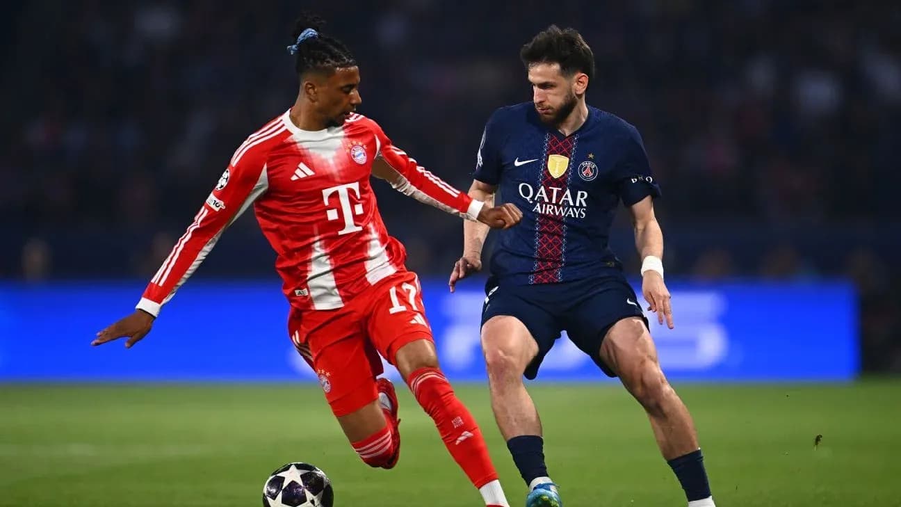Bayern player dribbling against PSG opponent