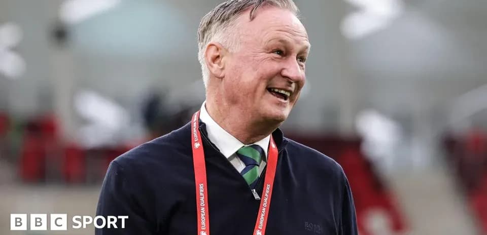 Man smiling with a European Qualifiers lanyard