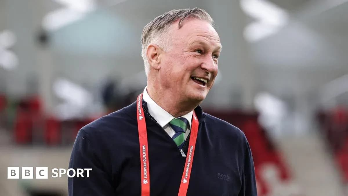 Man smiling with a European Qualifiers lanyard