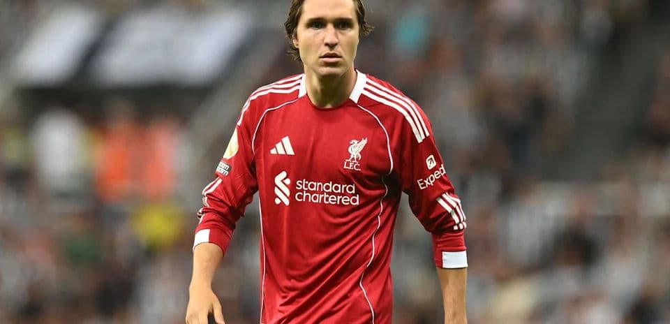 Player wearing Liverpool kit on the pitch