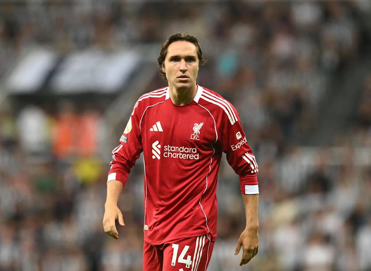 Player wearing Liverpool kit on the pitch