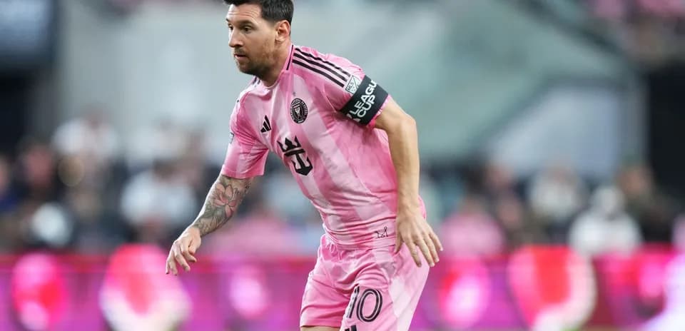 Lionel Messi in pink Inter Miami jersey on field