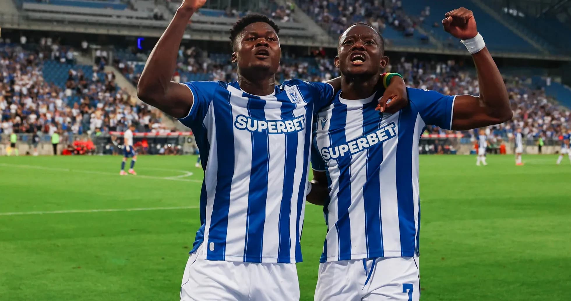 Players celebrating after a goal during match