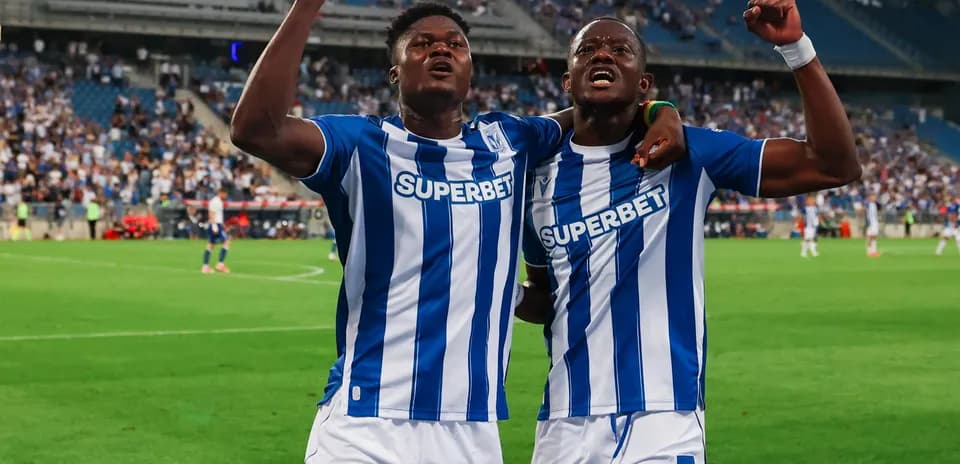 Players celebrating after a goal during match