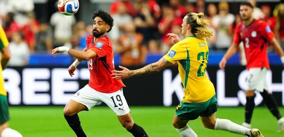 Player 19 from Egypt controls the ball against Australia