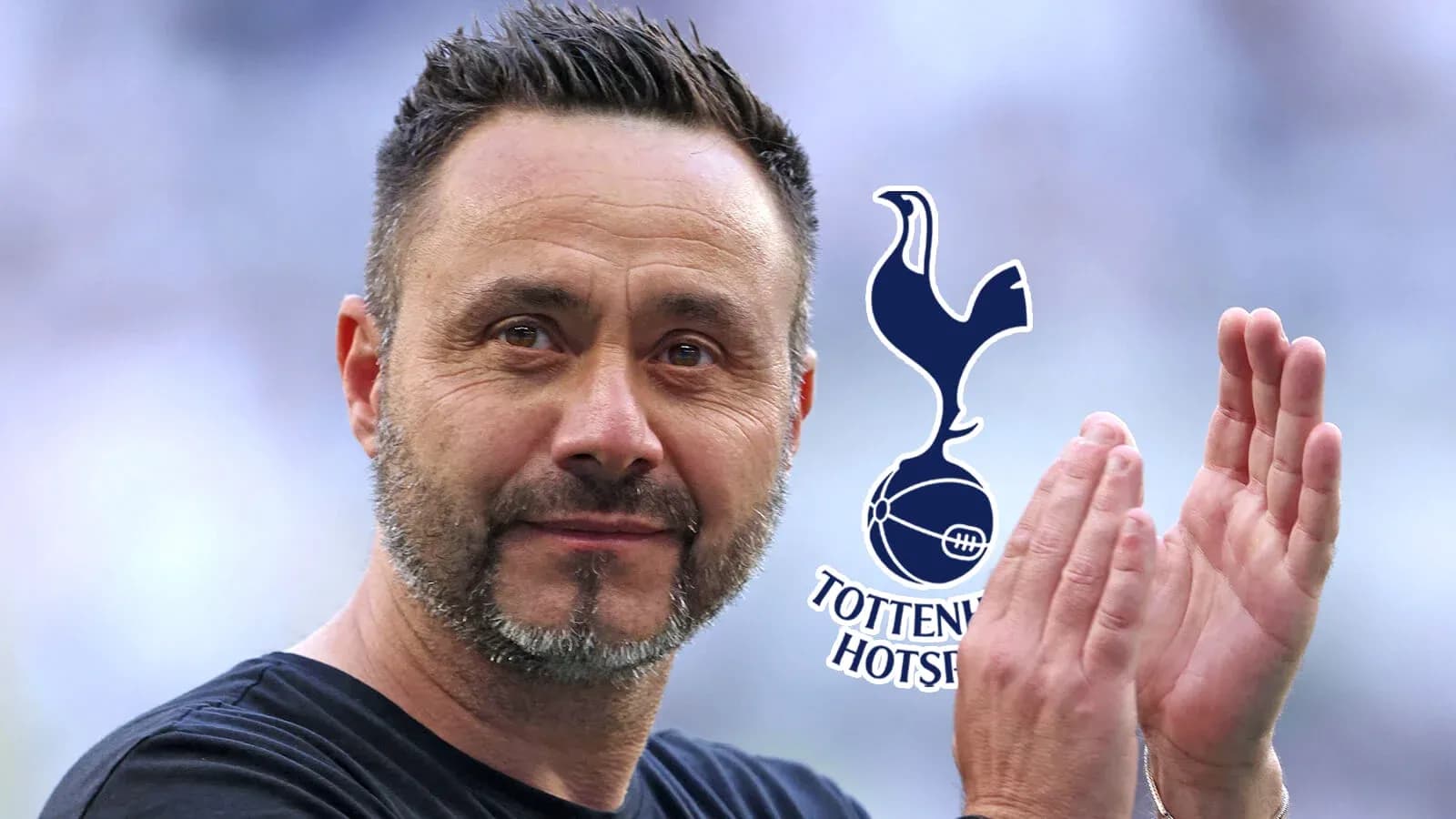 Coach applauding with Tottenham Hotspur logo in background