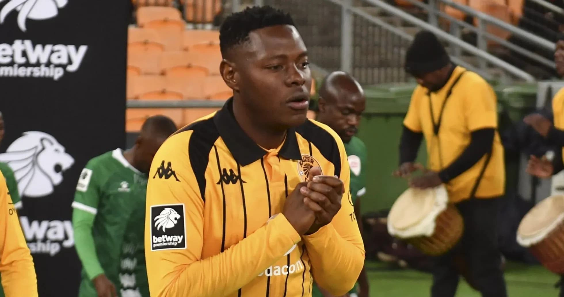 Player in yellow jersey walking onto the field