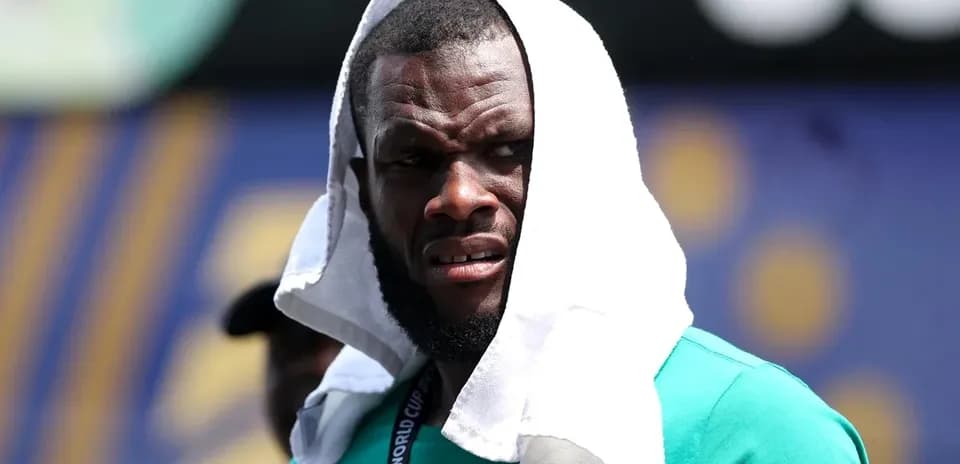 Player with towel on head during warm-up