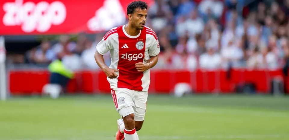 Ajax player running with the ball during match