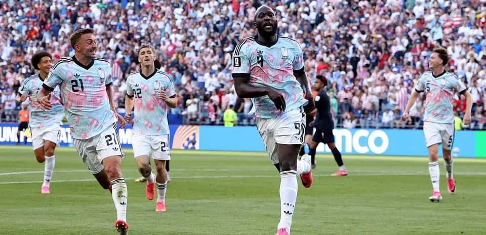 Players celebrating a goal during soccer match
