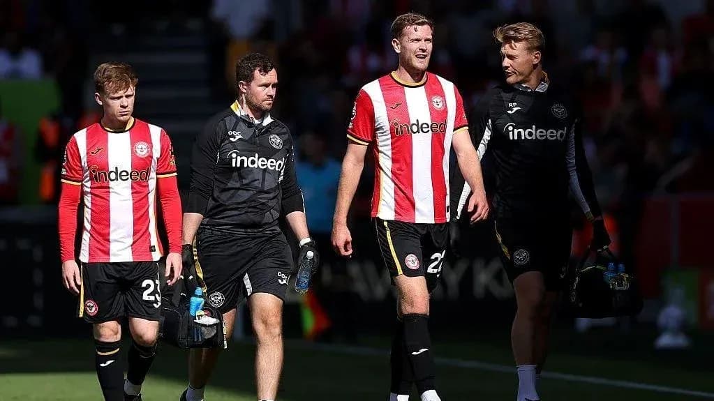 Brentford players leaving the pitch after match