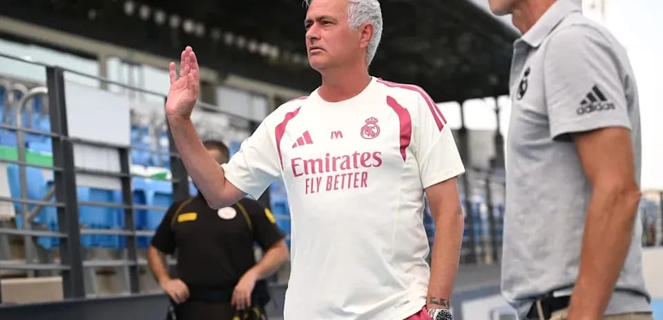 Coach gesturing during training session at stadium