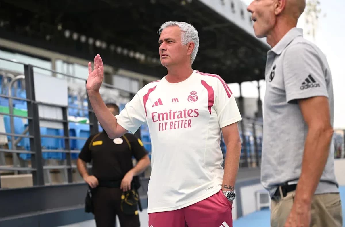 Coach gesturing during training session at stadium