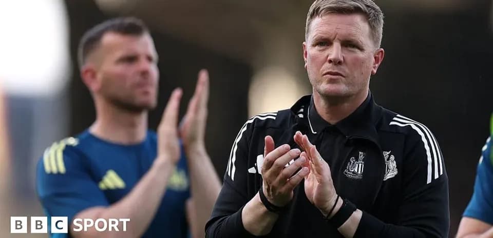 Coach applauding during training session with staff