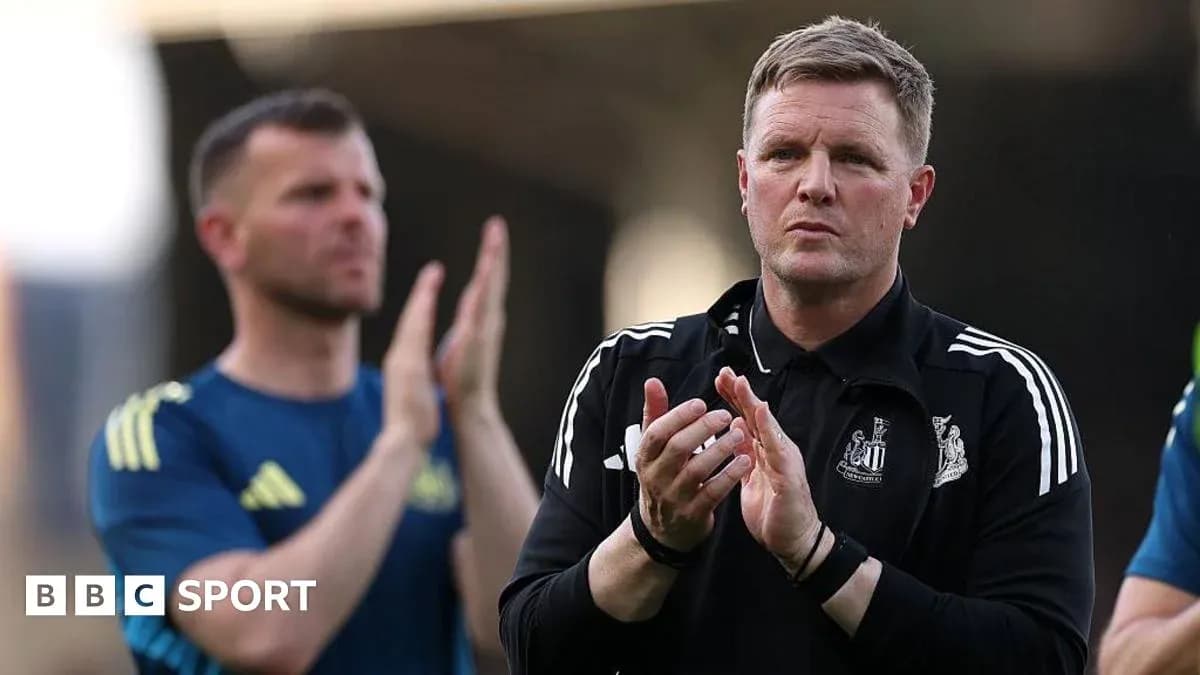 Coach applauding during training session with staff