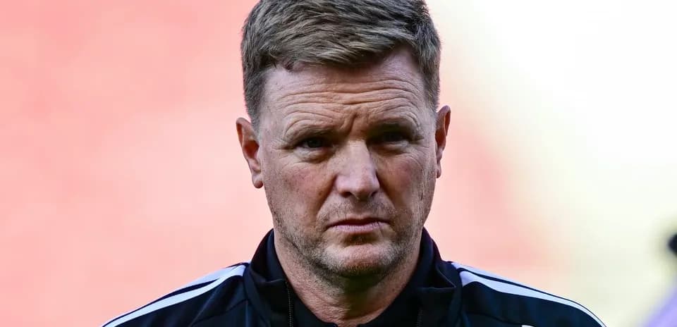 Football manager looking on during match warm-up