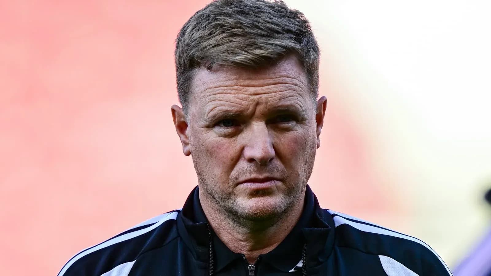 Football manager looking on during match warm-up