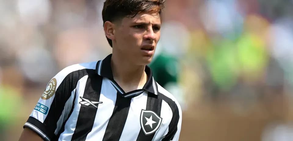 Player in black and white jersey on field