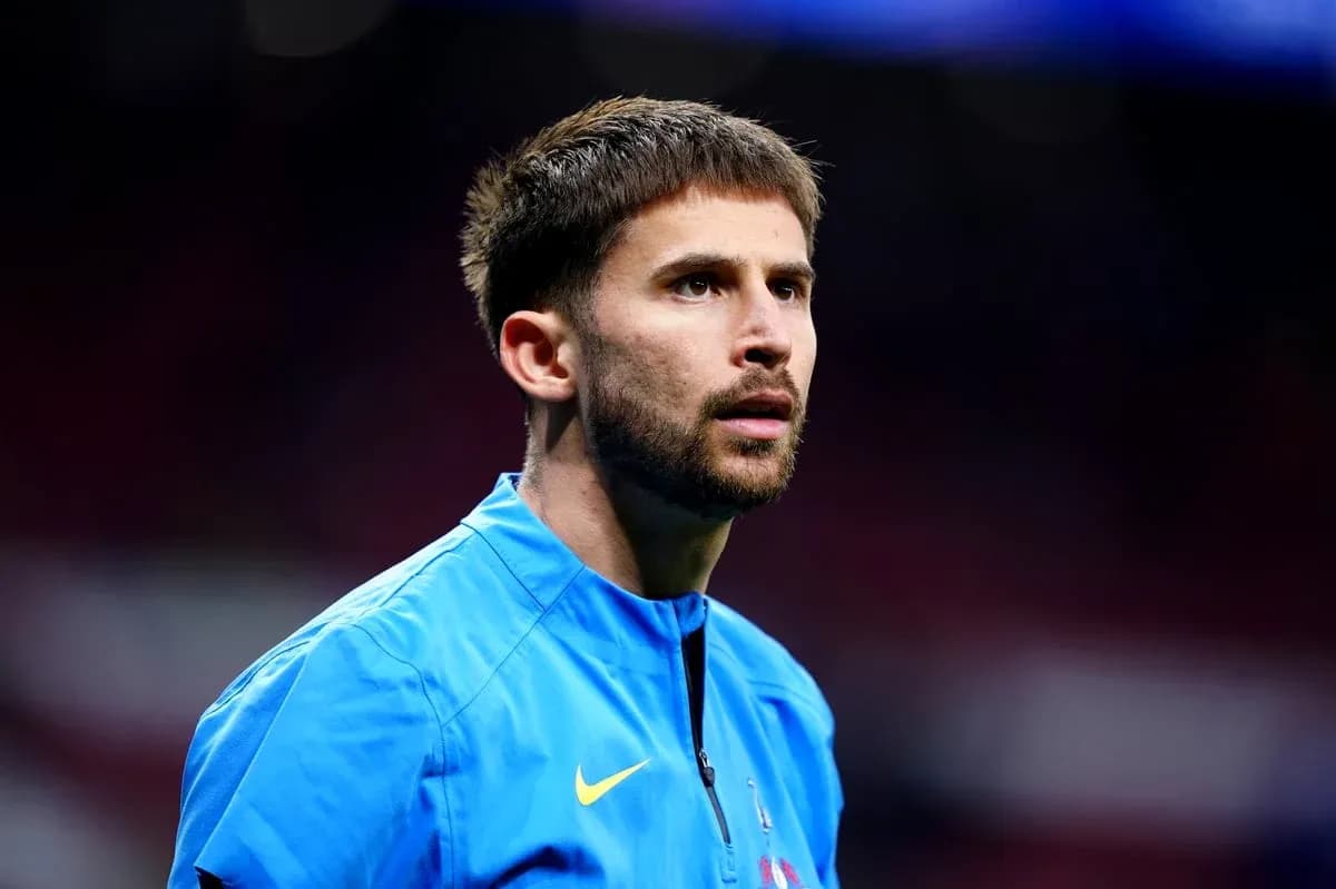 Player in blue training kit during warm-up
