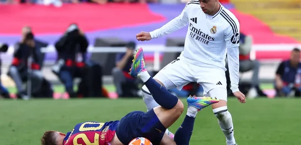 Barcelona player on the ground during El Clasico