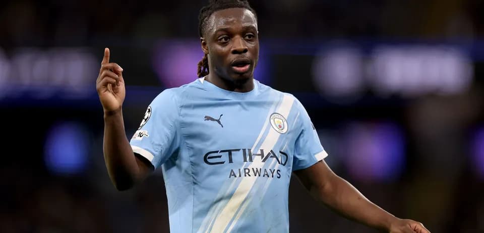 Player gesturing during match in Manchester City kit