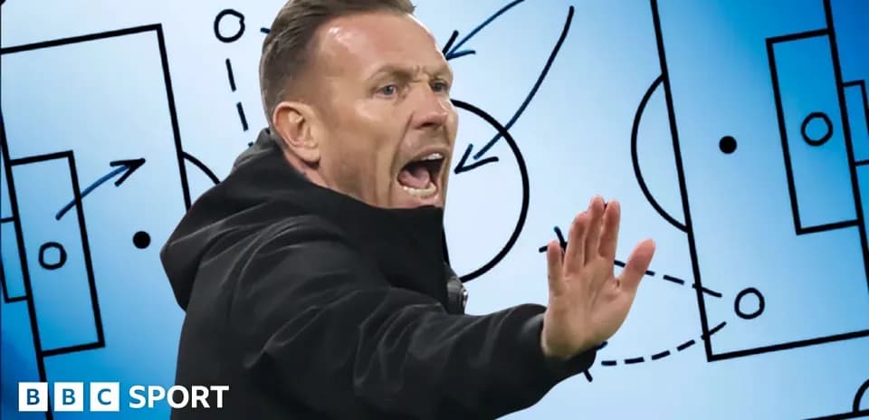 Coach gesturing during tactical discussion on strategy