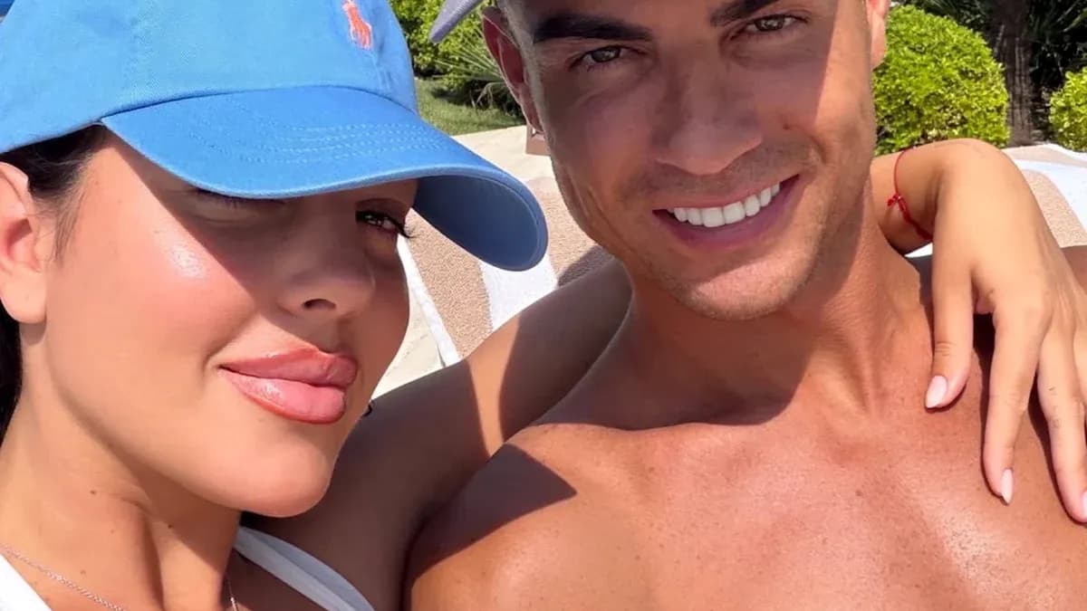Couple posing for selfie in sunny outdoor setting