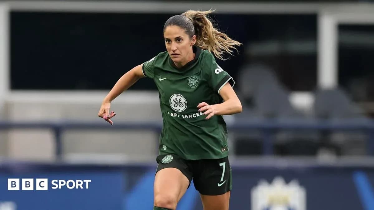 Player in green kit running on the field