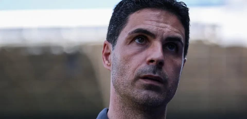 Coach speaking during a press conference