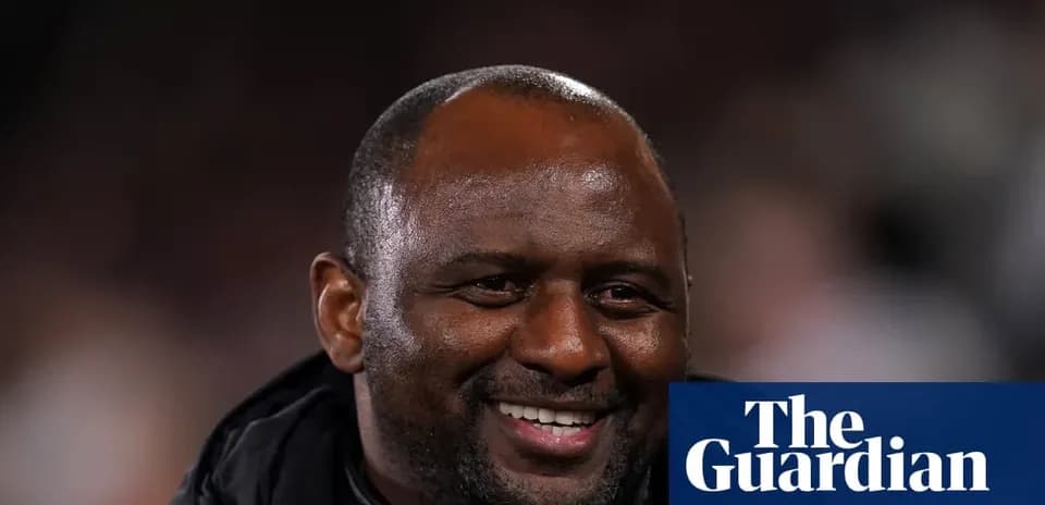 Coach smiling during a match in the stands