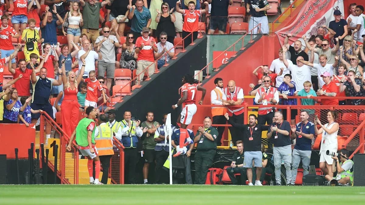 Fans celebrating a goal at the stadium